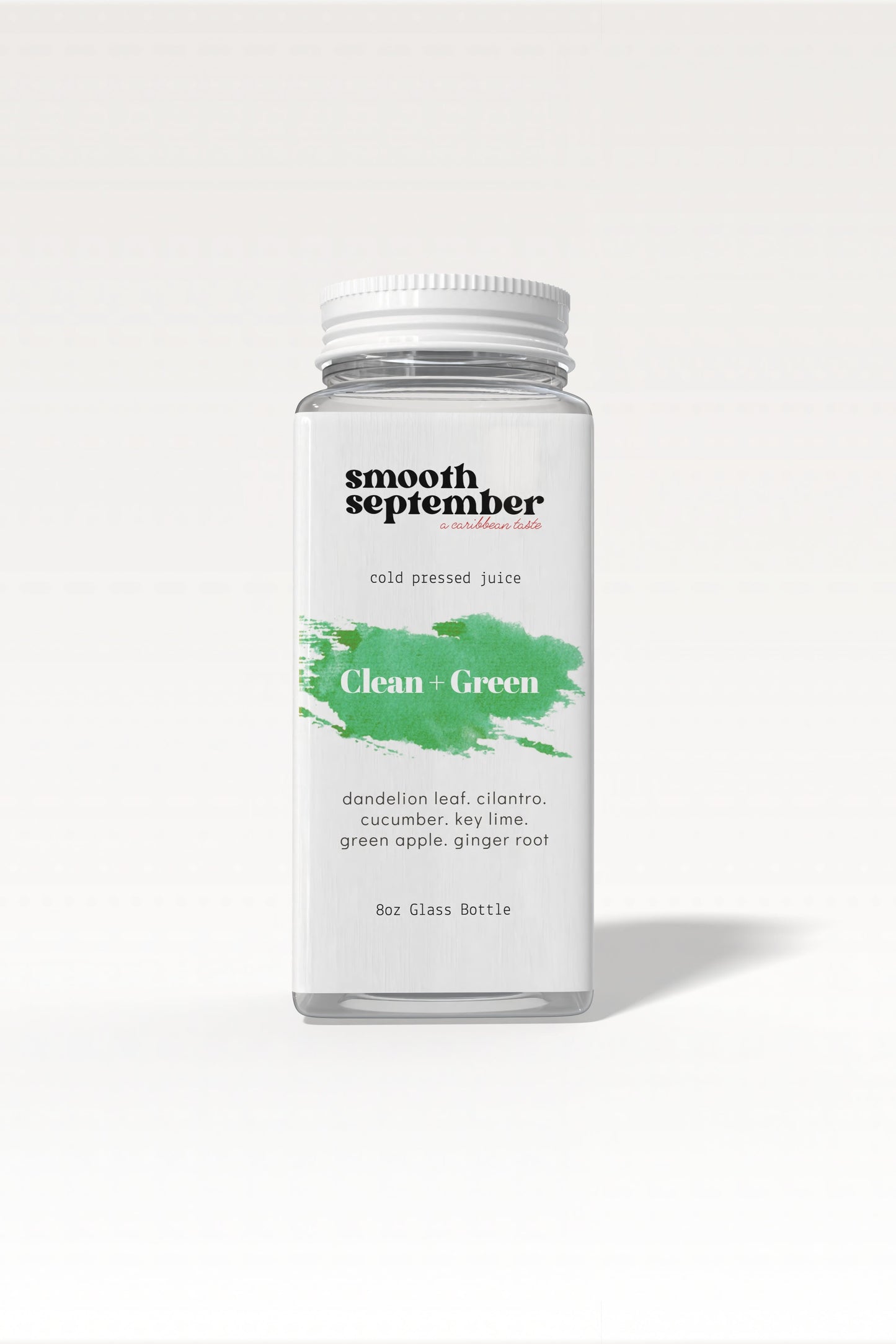 A bottle of vibrant, cold-pressed green juice with ingredients listed as dandelion leaf, cucumber, apple, and ginger. The background is clean and simple.