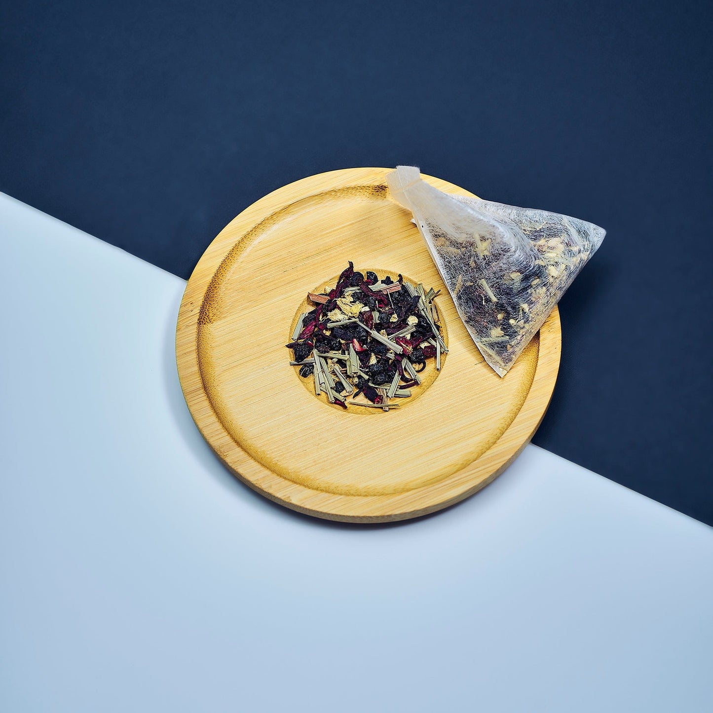 Smooth September - Biodegradable tea sachet bags filled with a vibrant herbal blend of elderberry, ginger, fever grass, and hibiscus – a soothing, eco-conscious tea infusion for wellness and vitality.