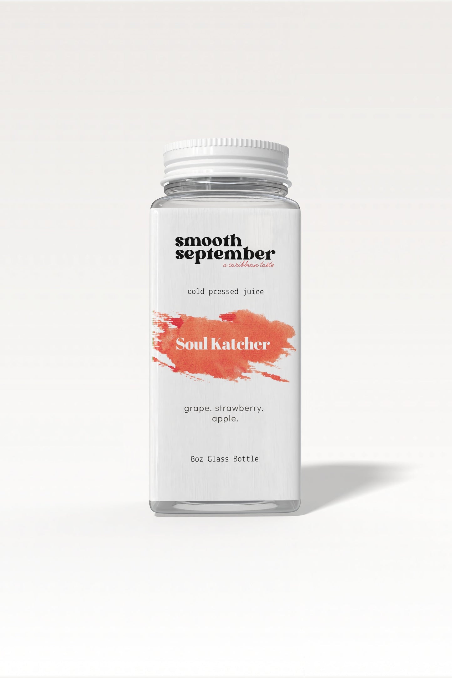 A photo of the Soul Katcher Cold-Pressed Juice bottle, showcasing its label with a blend of strawberry, apple, and grape.