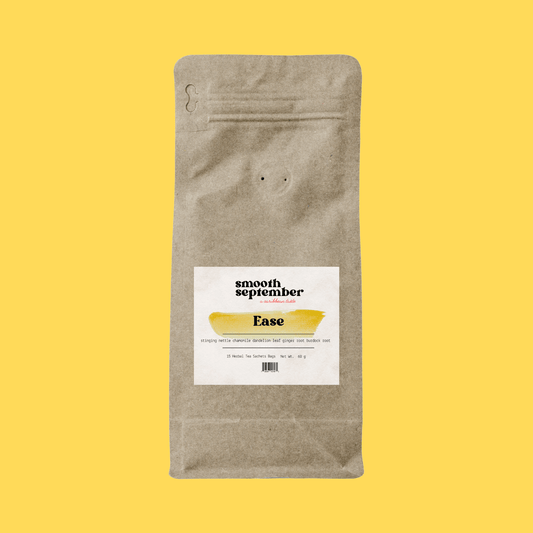 Smooth September, A natural herbal arrangement featuring dandelion leaf, fresh ginger root, nettle leaves, chamomile flowers, and dried burdock root on a yellow golden background.