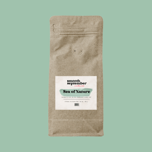 Brown paper resealable pouch labeled “Smooth September – Sea of Nature,” a nourishing herbal tea made with sarsaparilla, sea moss, bladderwrack, and burdock root. The label features a green brushstroke design on a muted green background.