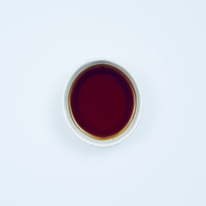 A close-up of Cooling Mint Herbal Tea by Our Tea Collection, showcasing organic healthy drinks that combine peppermint, eucalyptus, and spearmint for a caffeine-free experience, promoting digestion and mental clarity with herbal blend tea.