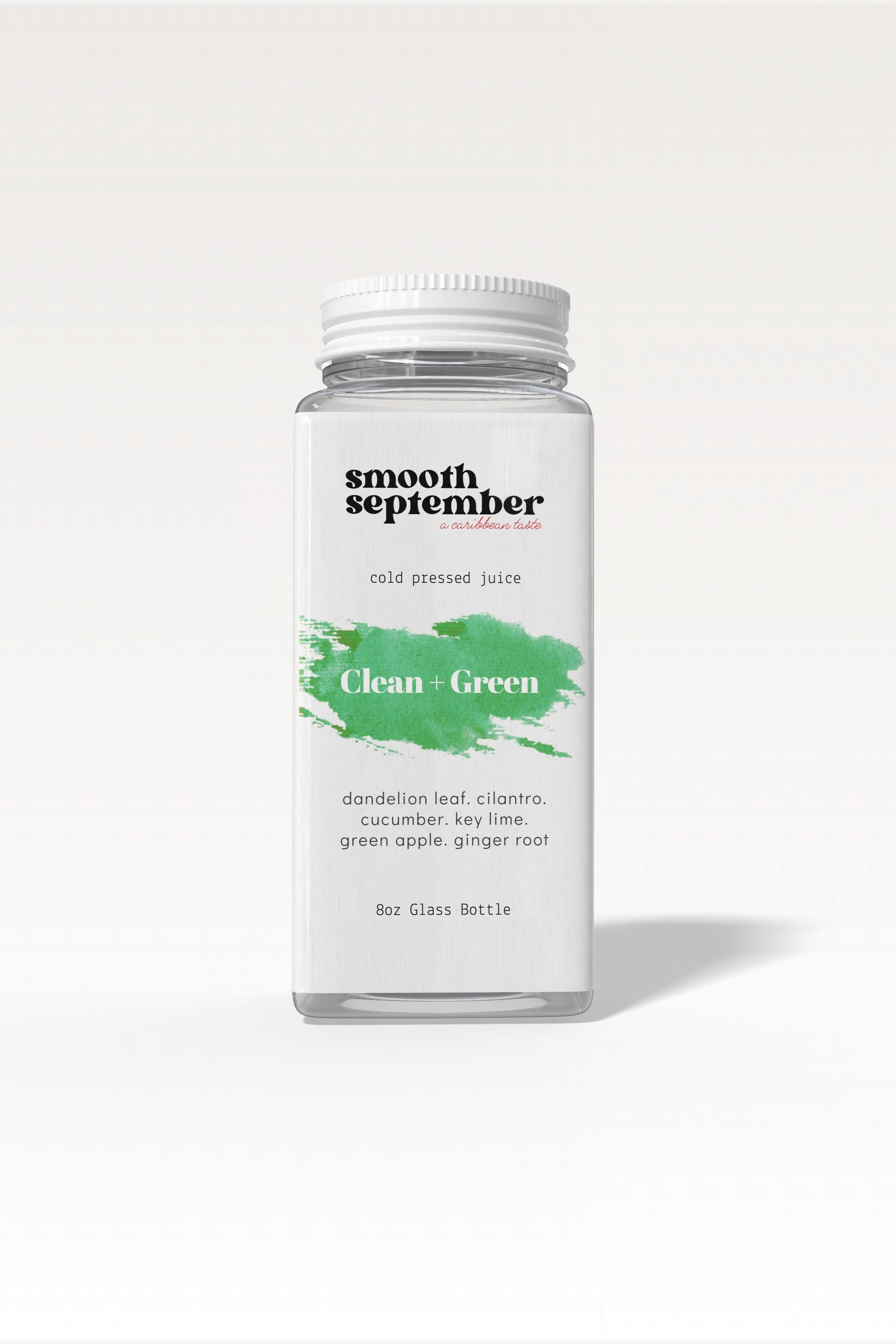 A bottle of vibrant, cold-pressed green juice with ingredients listed as dandelion leaf, cucumber, apple, and ginger. The background is clean and simple.