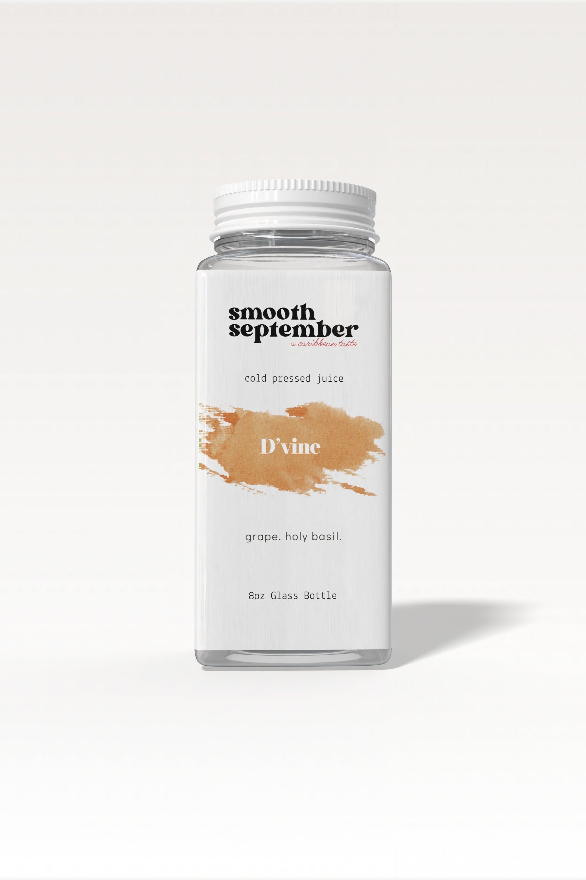 A bottle of D’vine cold-pressed juice, showcasing its deep brown color from grapes and holy basil.