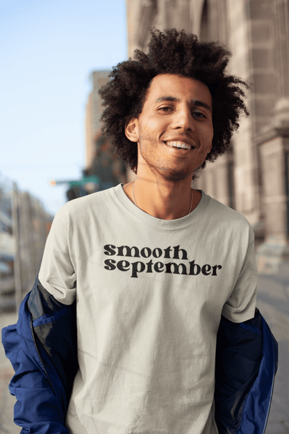 The Sand colored Smooth September Soft Cotton T-Shirt, a premium heavyweight tee that reflects the essence of the Caribbean, ideal for casual outings while sipping on elderberry tonic or a delicious herbal blend tea.
