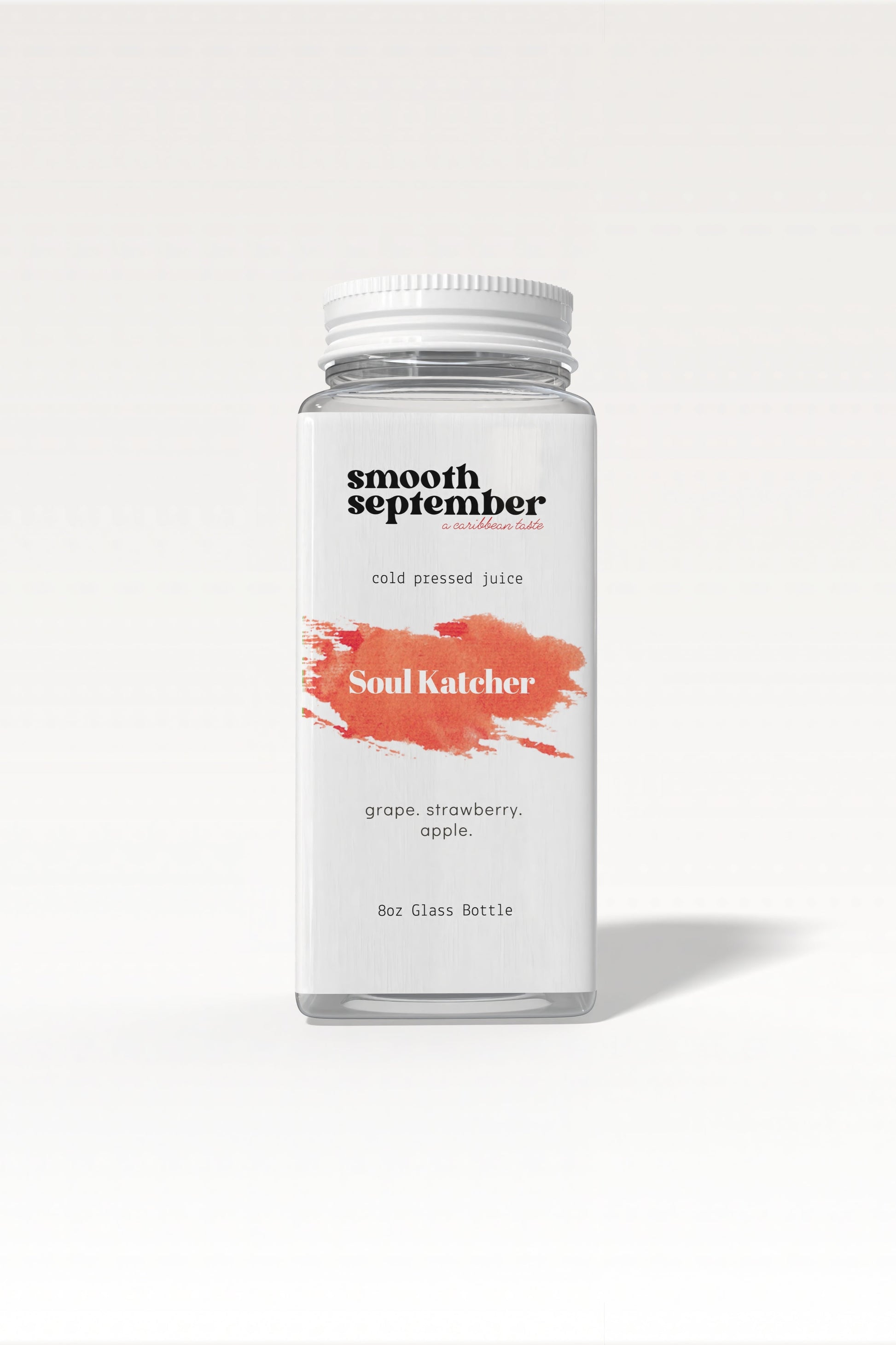 A photo of the Soul Katcher Cold-Pressed Juice bottle, showcasing its label with a blend of strawberry, apple, and grape.